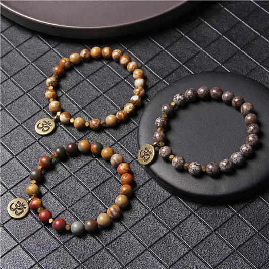 PULSERA COLGANTE OM TIERRA